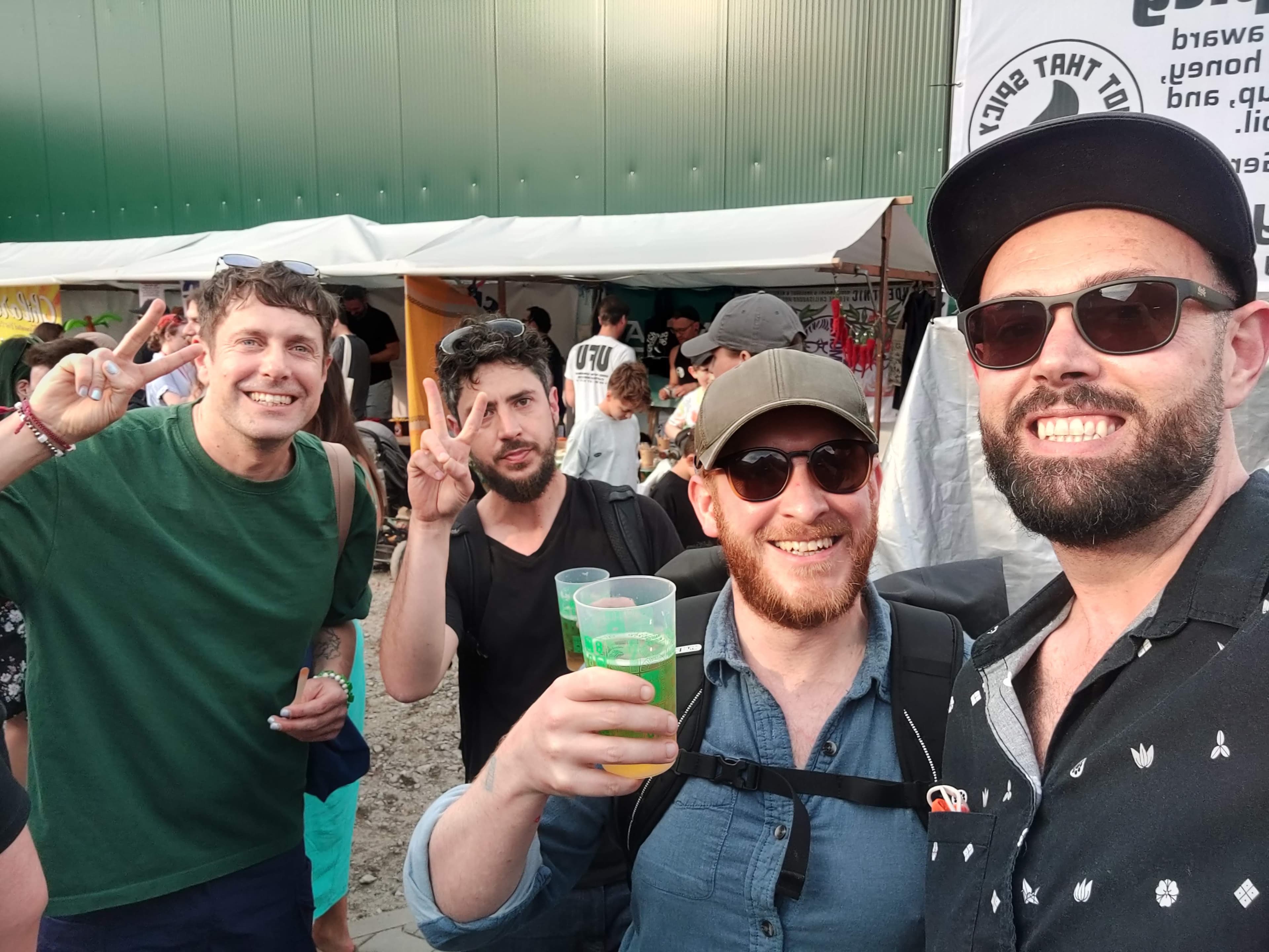 Hands of attendees stirring pots